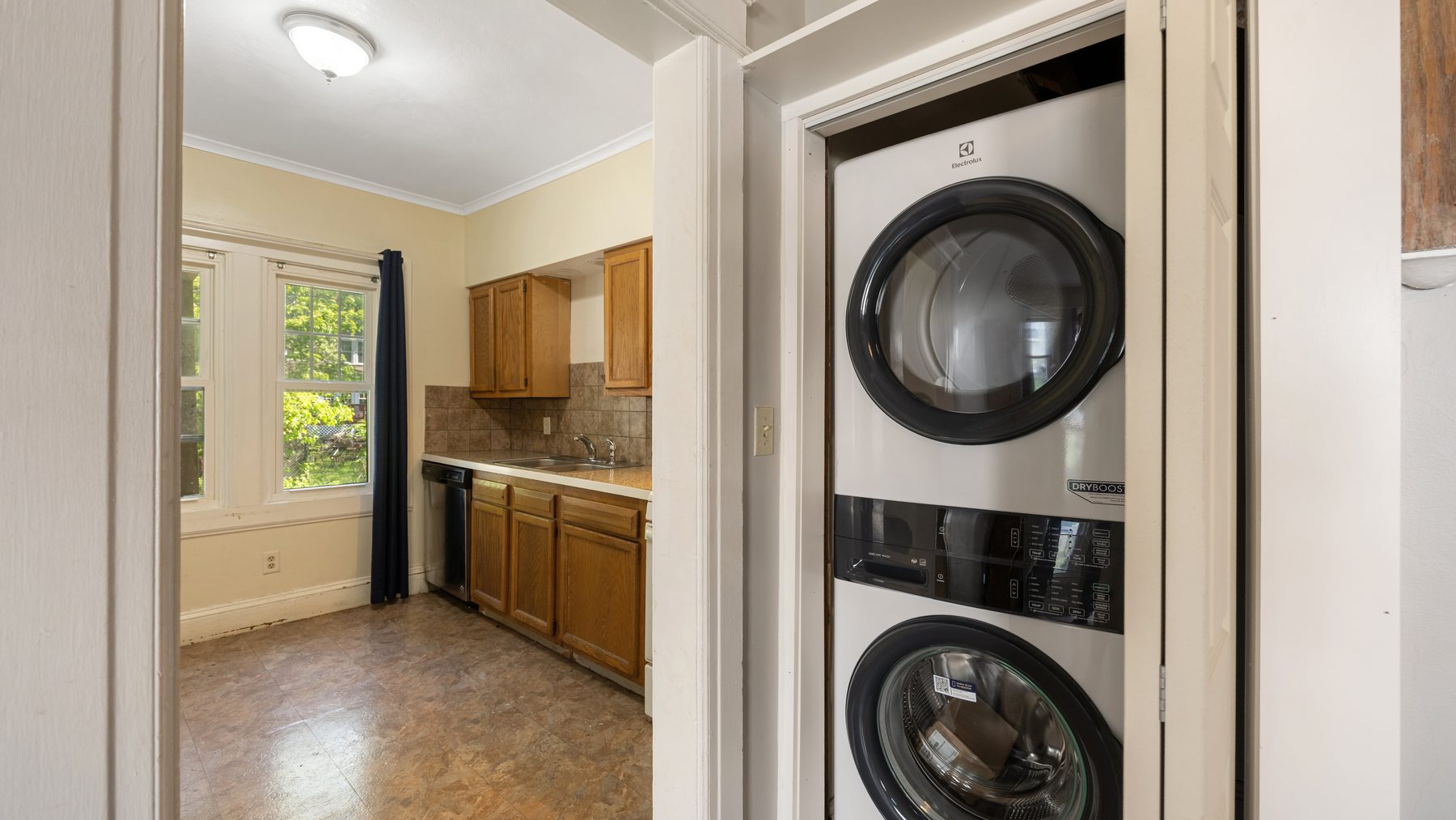 135 Redfield Place - stacked washer and dryer off the kitchen