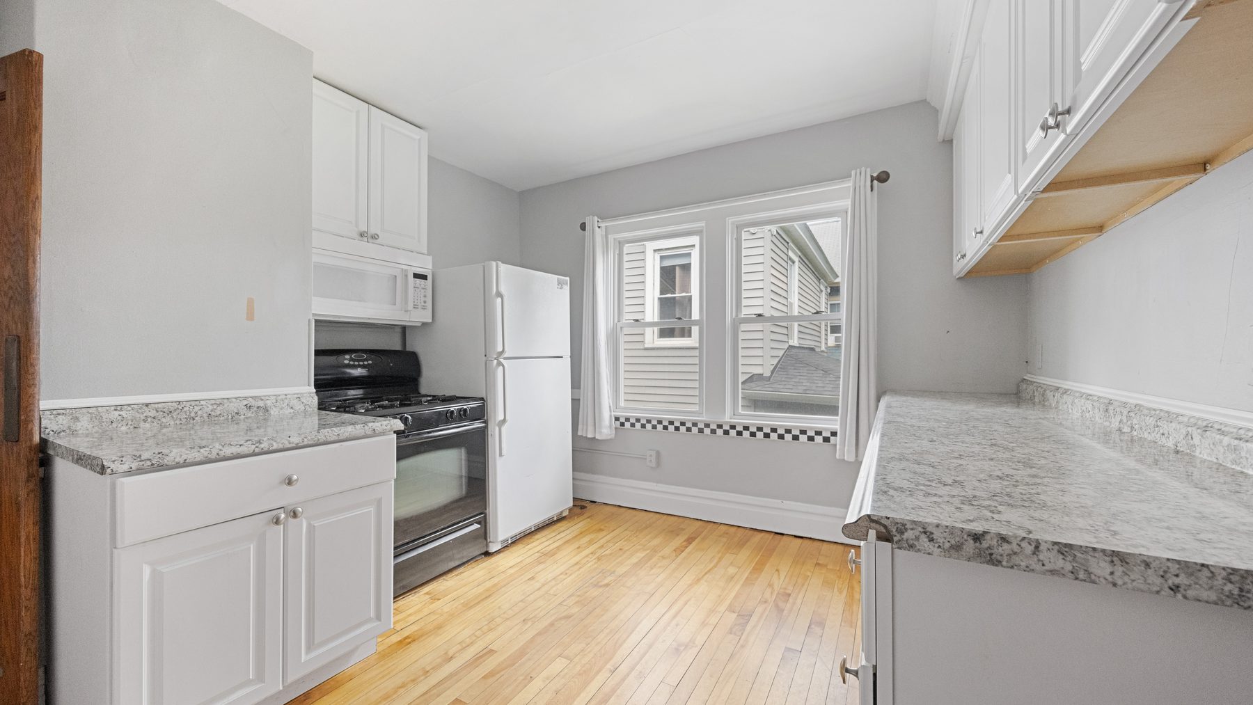 825 Ackerman Avenue - kitchen with gas range and full-size refrigerator