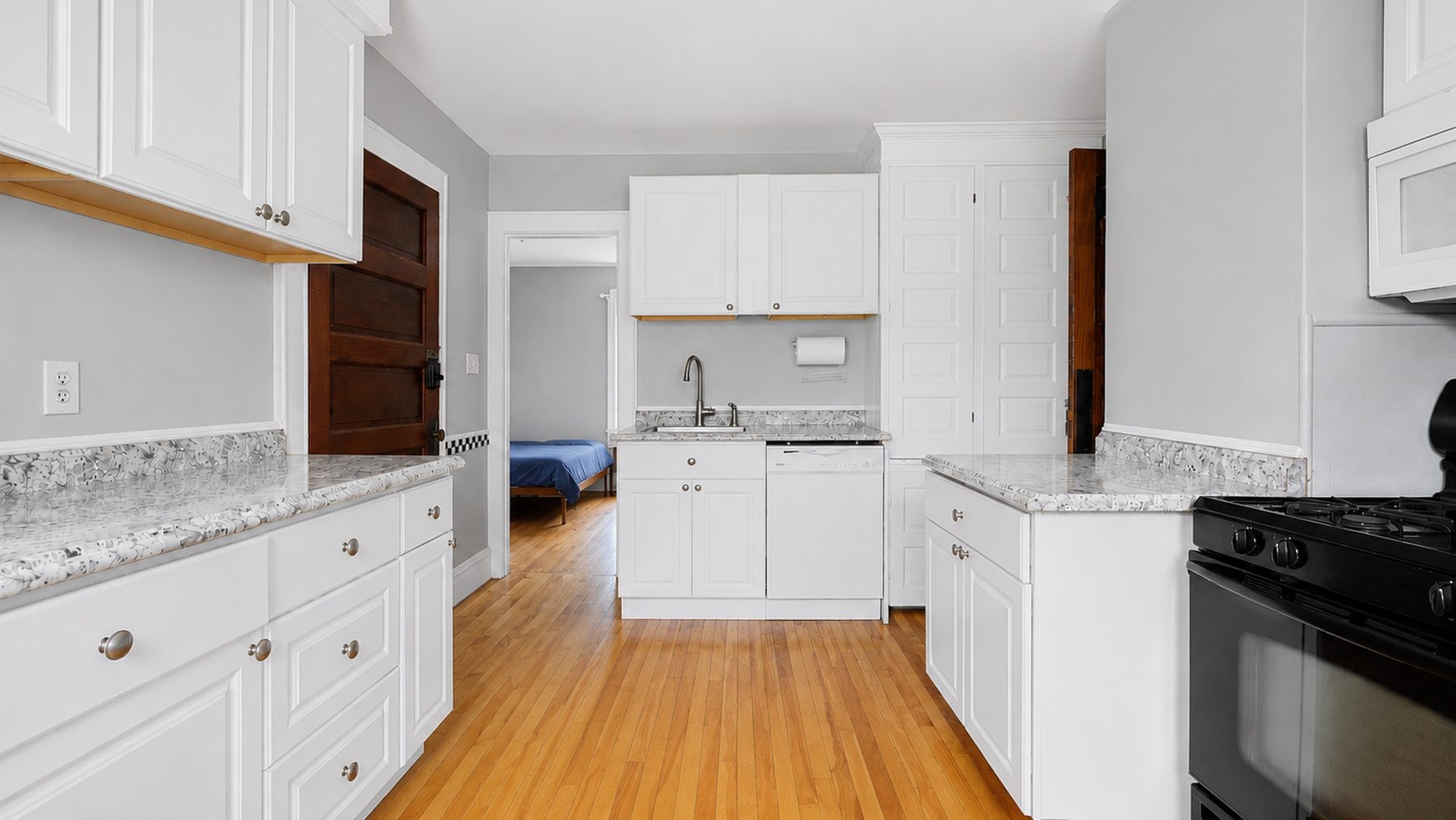 825 Ackerman Avenue - kitchen looking through to a bedroom