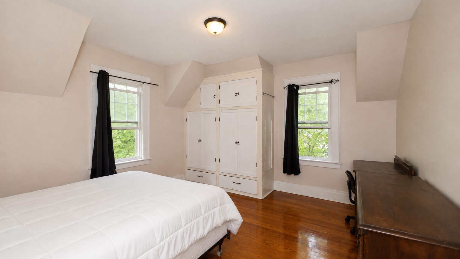 941 Comstock Avenue - bedroom with built-in wardrobe and desk